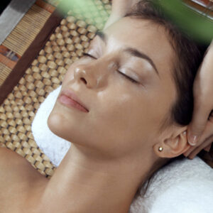 woman relaxing with head massage